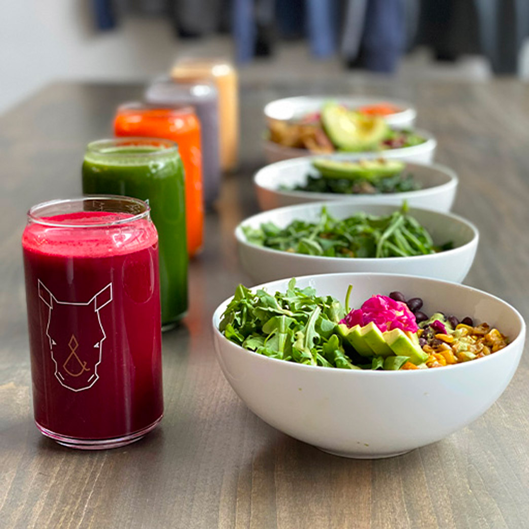 selection of vegan bowls, salads, and juices from Fix & Repeat's plant-based menu